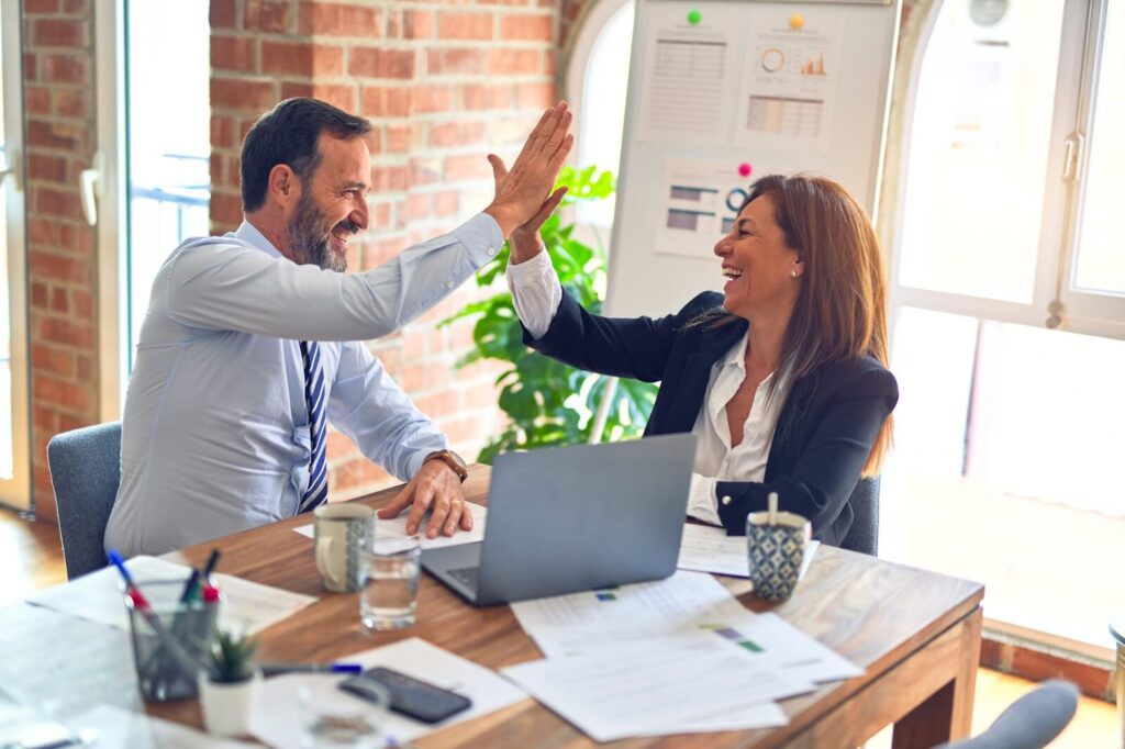 sales reps highfiving
